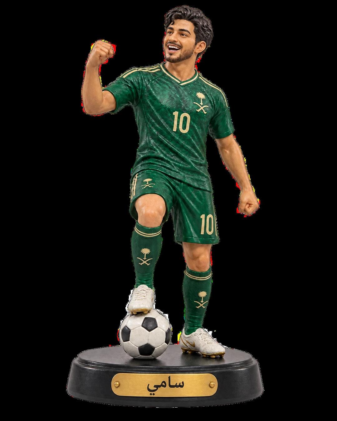 Saudi footballer Figurine in a green kit with a football