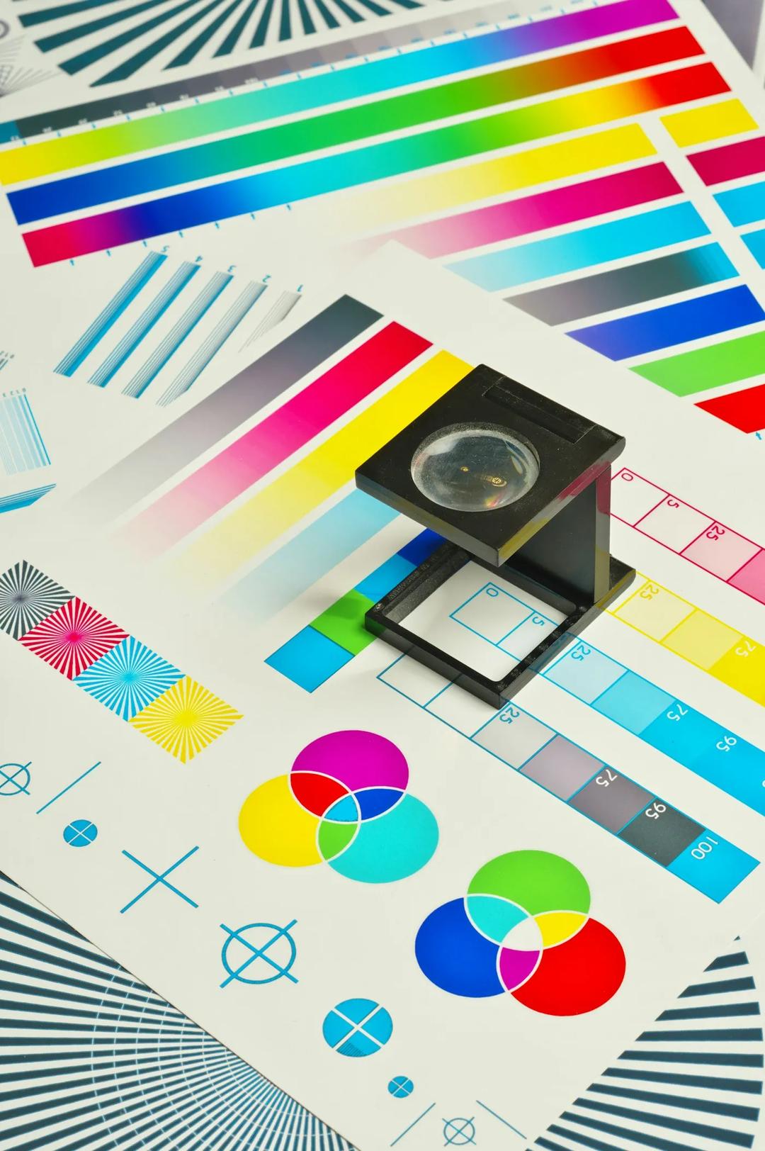 A loupe over a printed color chart